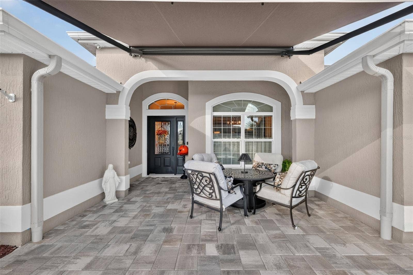 1793 WAX BERRY COURT, The Villages, FL 32163 Front Entry with Paver Patio and Remote-Controlled Awning