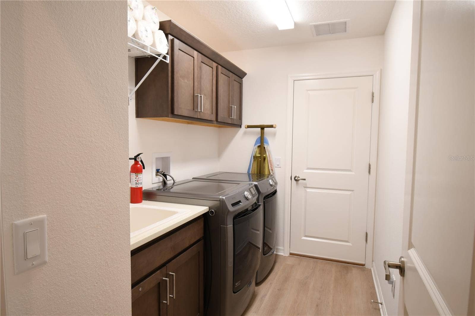 Laundry Room with Utility Sink and Added Cabinetry