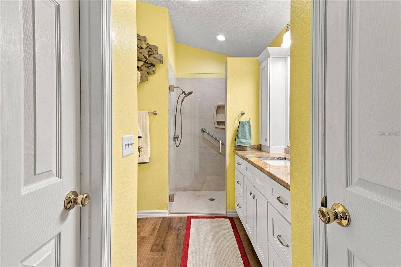 1115 SAN BERNARDO ROAD, The Villages, FL 32162 Primary shower and dressing area