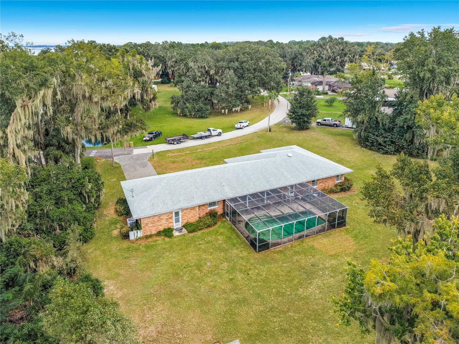 8038 SPRING DRIVE, Yalaha, FL 34797 Backyard -- Screened-In Pool