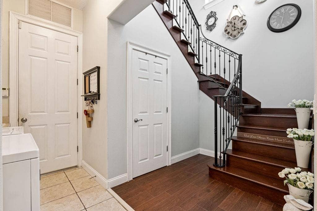 1066 CEASARS CT, Mount Dora, FL 32757 Door to garage and stairway to 2nd floor