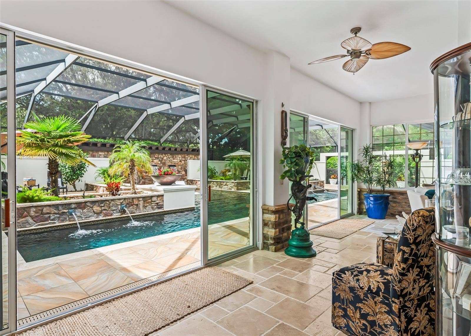 3 Sets of Sliding Glass Doors Overlooking Pool Area