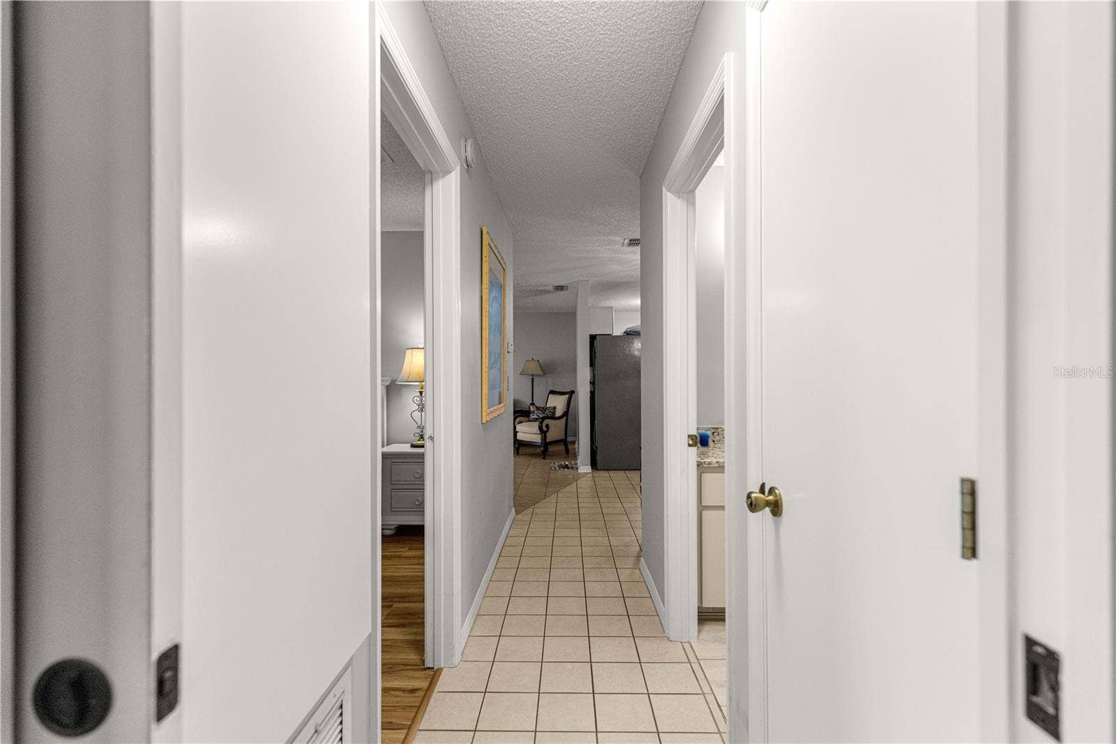 10434 SE 178TH PLACE, Summerfield, FL 34491 TILED HALLWAY CENTRAL LIVING AREA FROM BEDROOMS