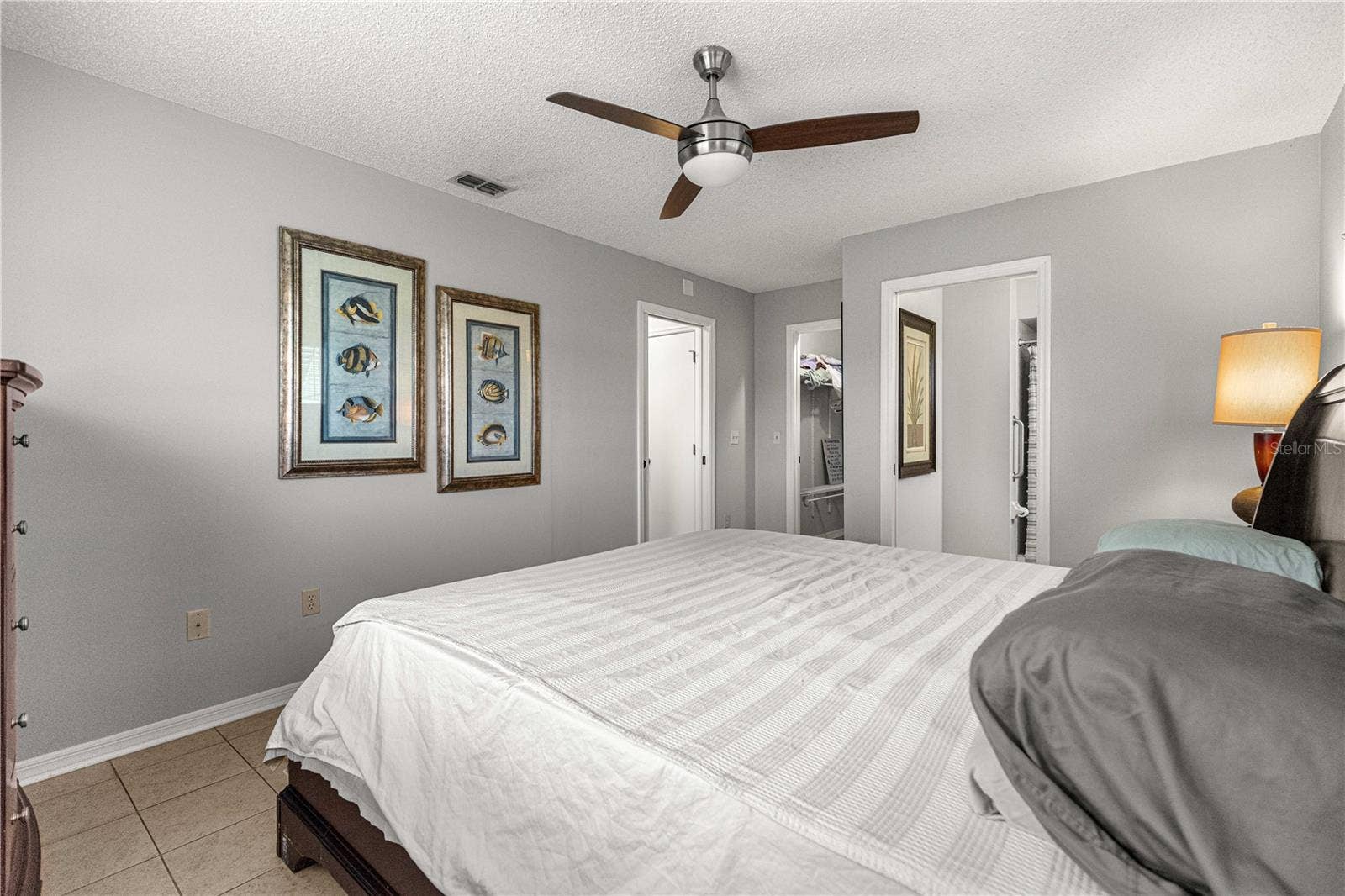 10434 SE 178TH PLACE, Summerfield, FL 34491 PRIMARY BEDROOM, WITH MODERN FAN AND TILED FLOORS