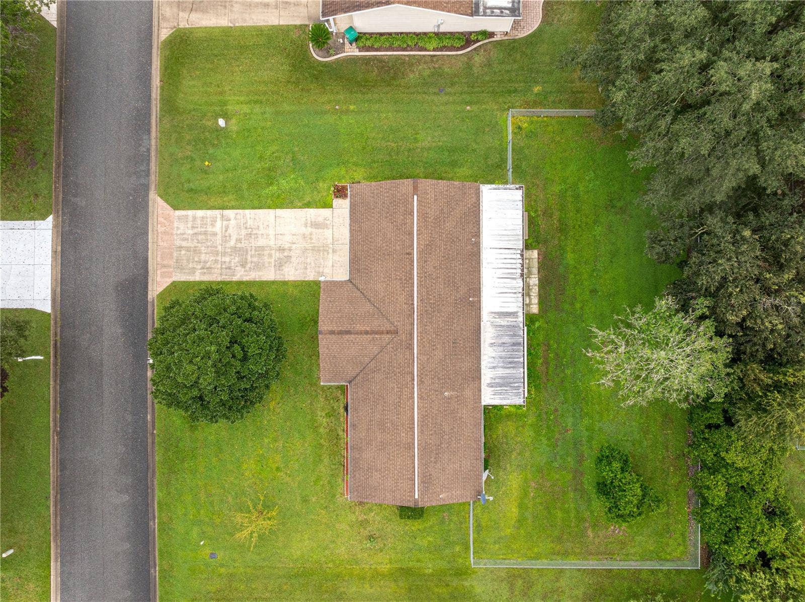 10434 SE 178TH PLACE, Summerfield, FL 34491 AERIAL OF THIS HOUSE SHOWING THE ROOF AND THE FENCED IN YARD