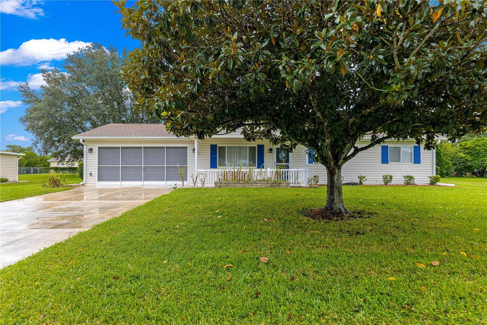 10434 SE 178TH PLACE, Summerfield, FL 34491 FRONT OF HOUSE THE DRIVEWAY JUST GOT POWER WASHED