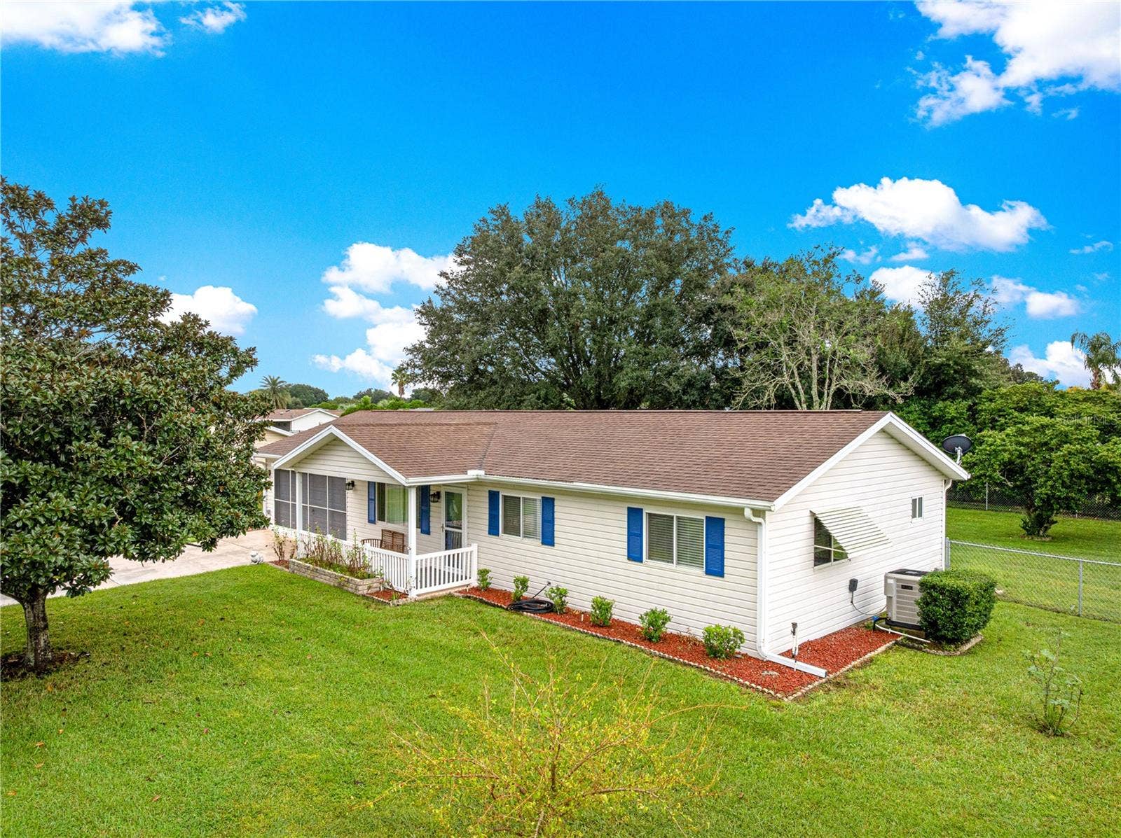 10434 SE 178TH PLACE, Summerfield, FL 34491 AERIAL OF FRONT OF HOUSE SHOWING WHERE THE H.V.A.C. IS LOCATED
