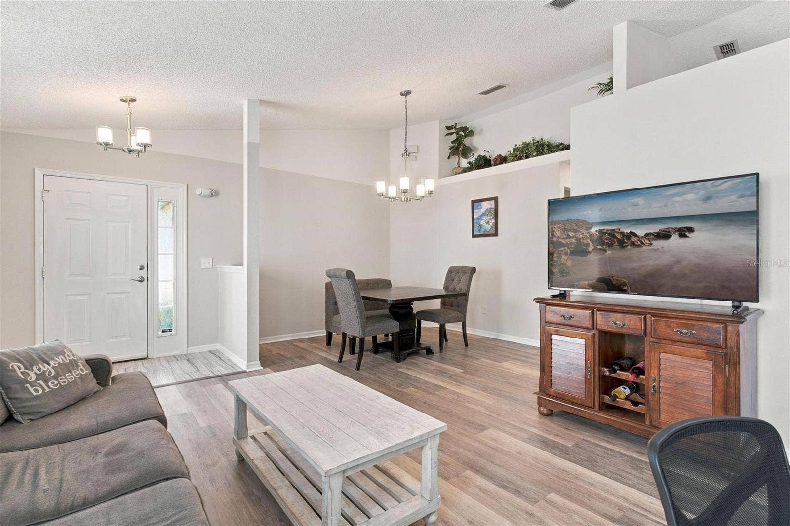 945 CLEAR CREEK CIRCLE, Clermont, FL 34714 Living Room/Dining Area with Shelving