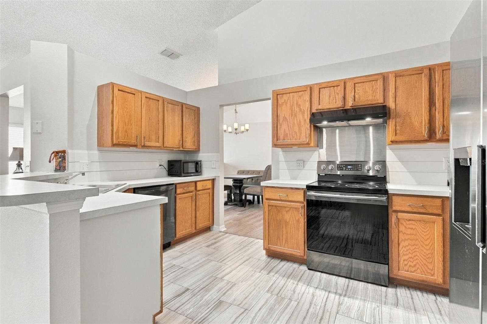 945 CLEAR CREEK CIRCLE, Clermont, FL 34714 Kitchen with Wood Vinyl Flooring