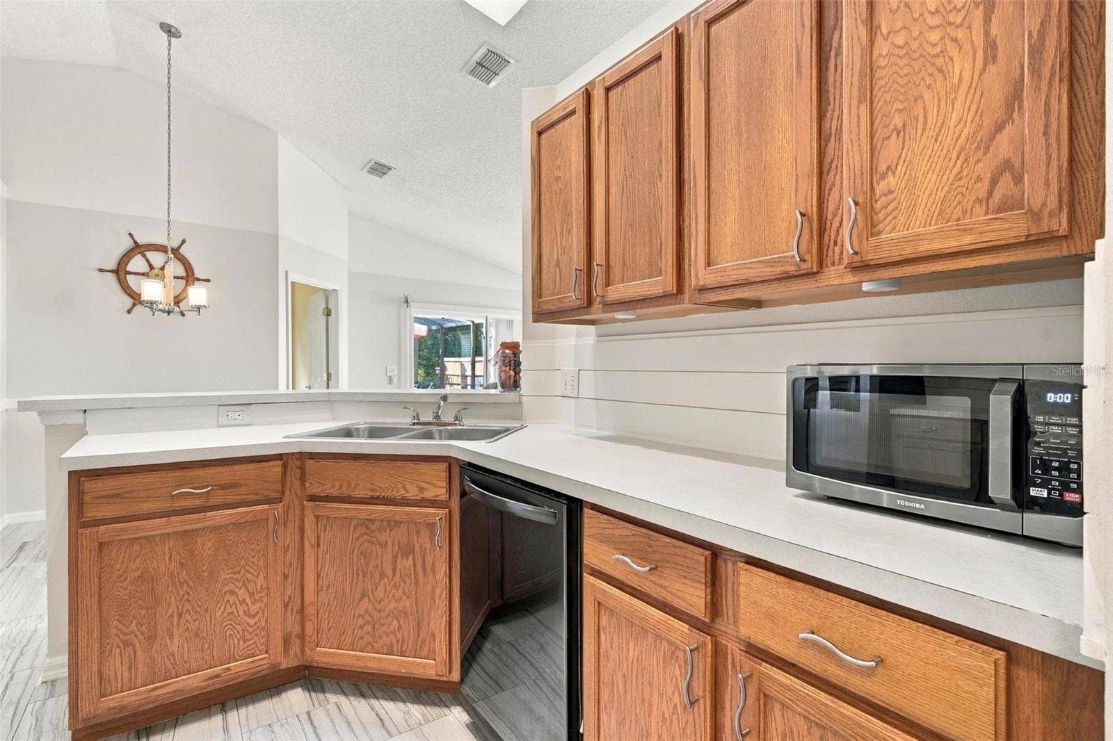 945 CLEAR CREEK CIRCLE, Clermont, FL 34714 Kitchen with Breakfast Bar