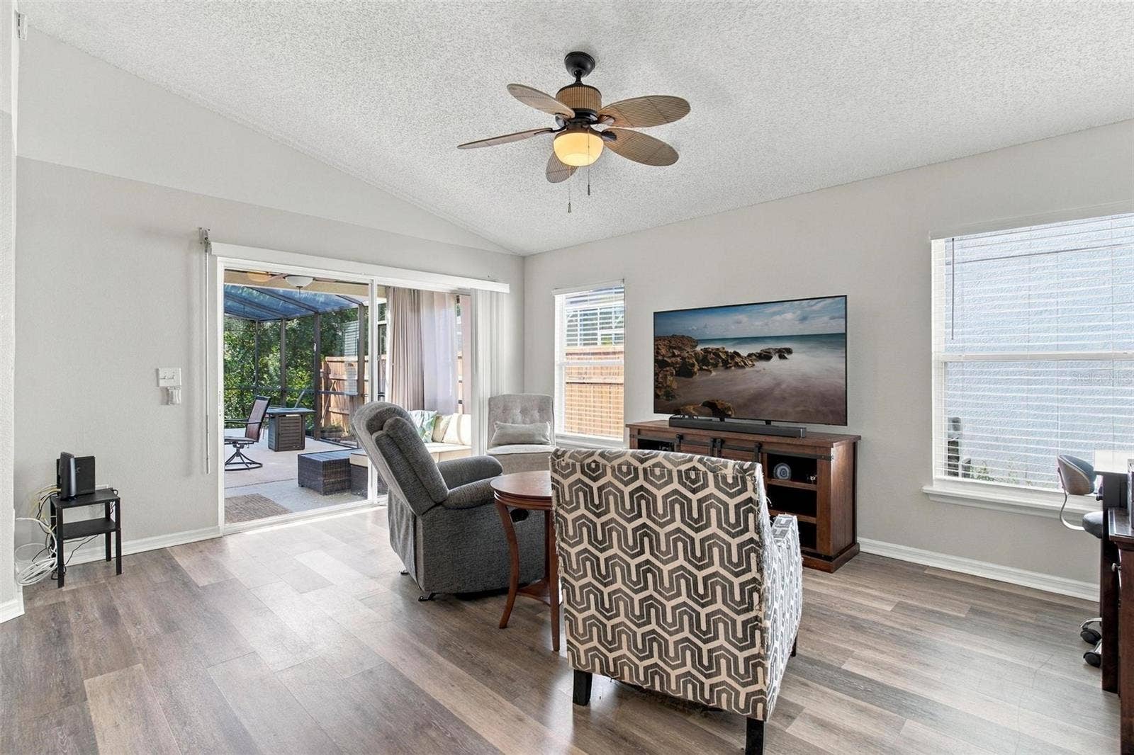 945 CLEAR CREEK CIRCLE, Clermont, FL 34714 Family Room with Sliding Doors to Pool