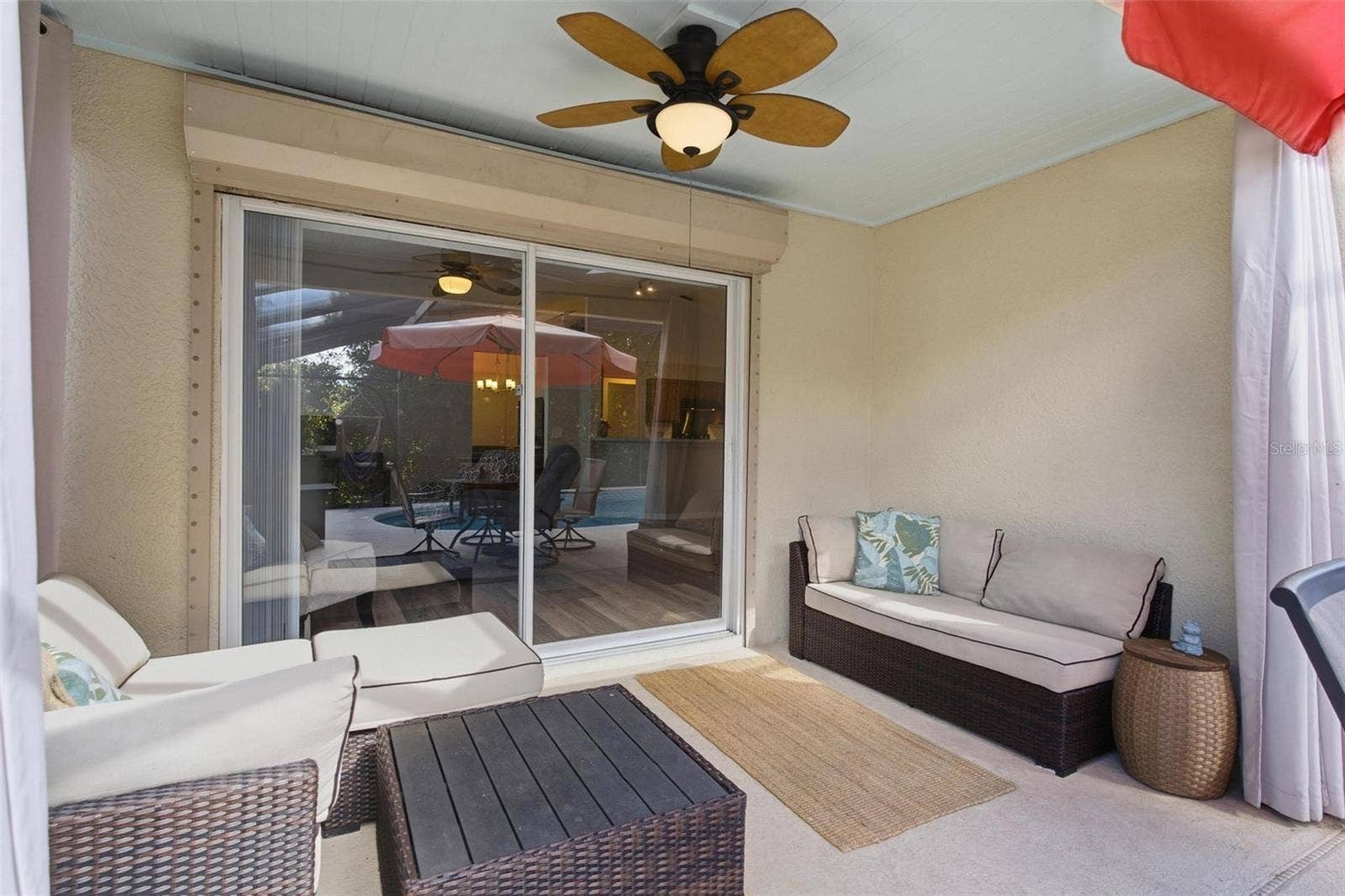 945 CLEAR CREEK CIRCLE, Clermont, FL 34714 Covered Lanai with Sliding Doors to Family Room