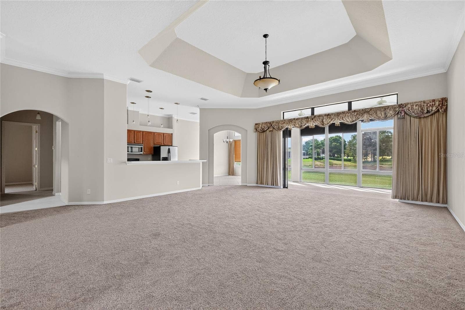 Living room with views of pond