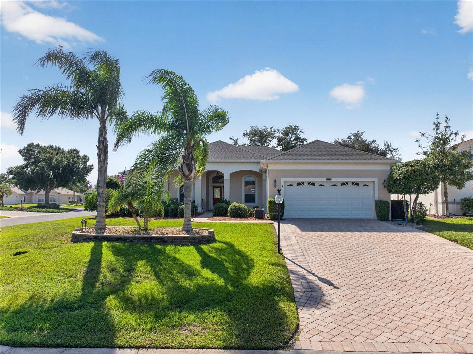 24151 BELLE MEDE DRIVE, Leesburg, FL 34748 LOOK AT THOSE PALM TREES SWAY.EXTRA DEEP GARAGE