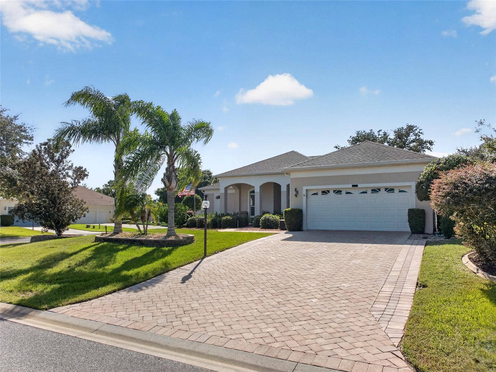 24151 BELLE MEDE DRIVE, Leesburg, FL 34748 SHE IS A BEAUTY. CORNER LOT, PALM TREES, BRICK PAVER DRIVEWAY