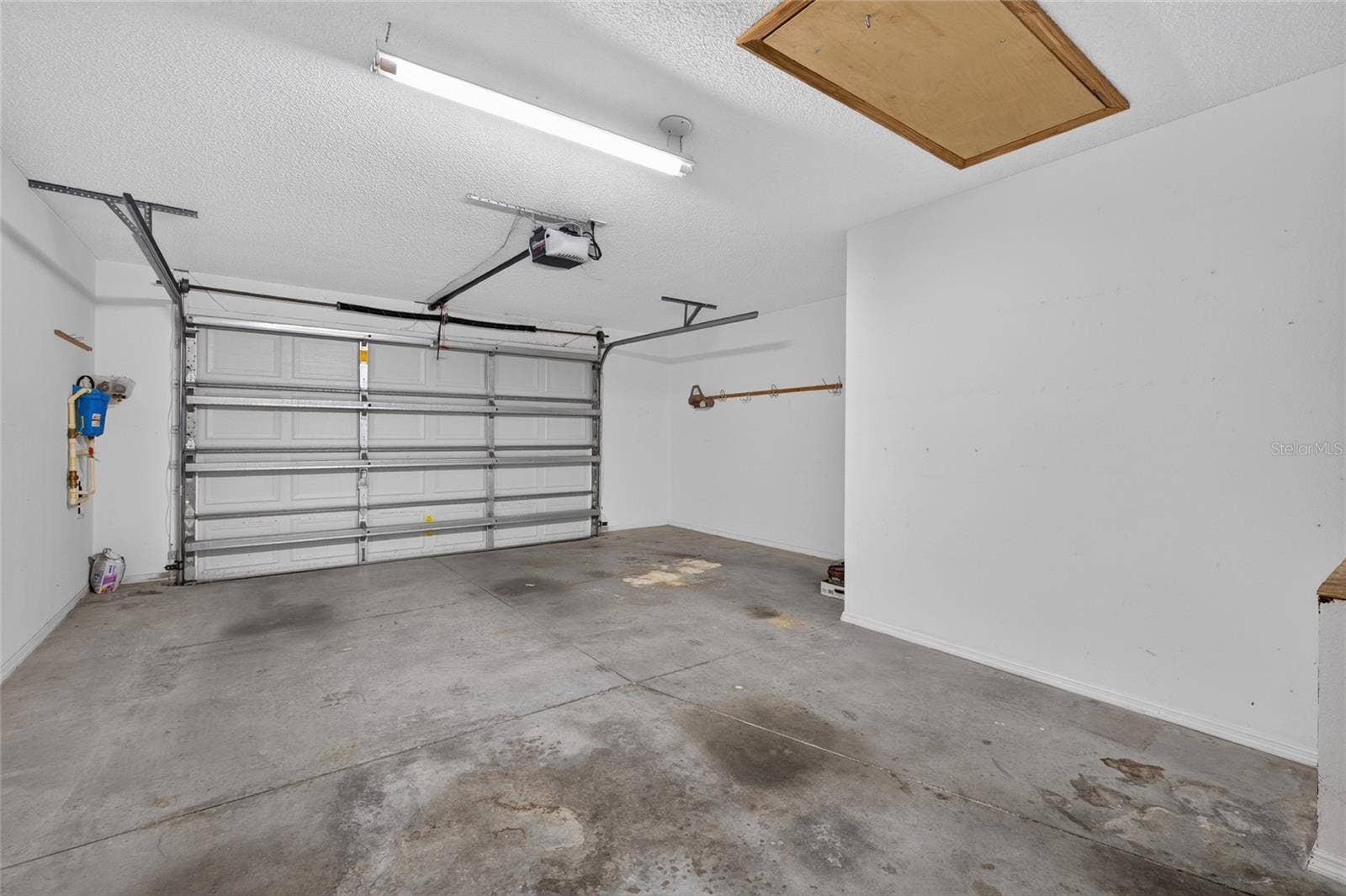 1.5 CAR GARAGE - PULL DOWN ATTIC STAIRS overhead (front R) and WHOLE-HOUSE WATER FILTRATION equipment on the L wall (west side of home).