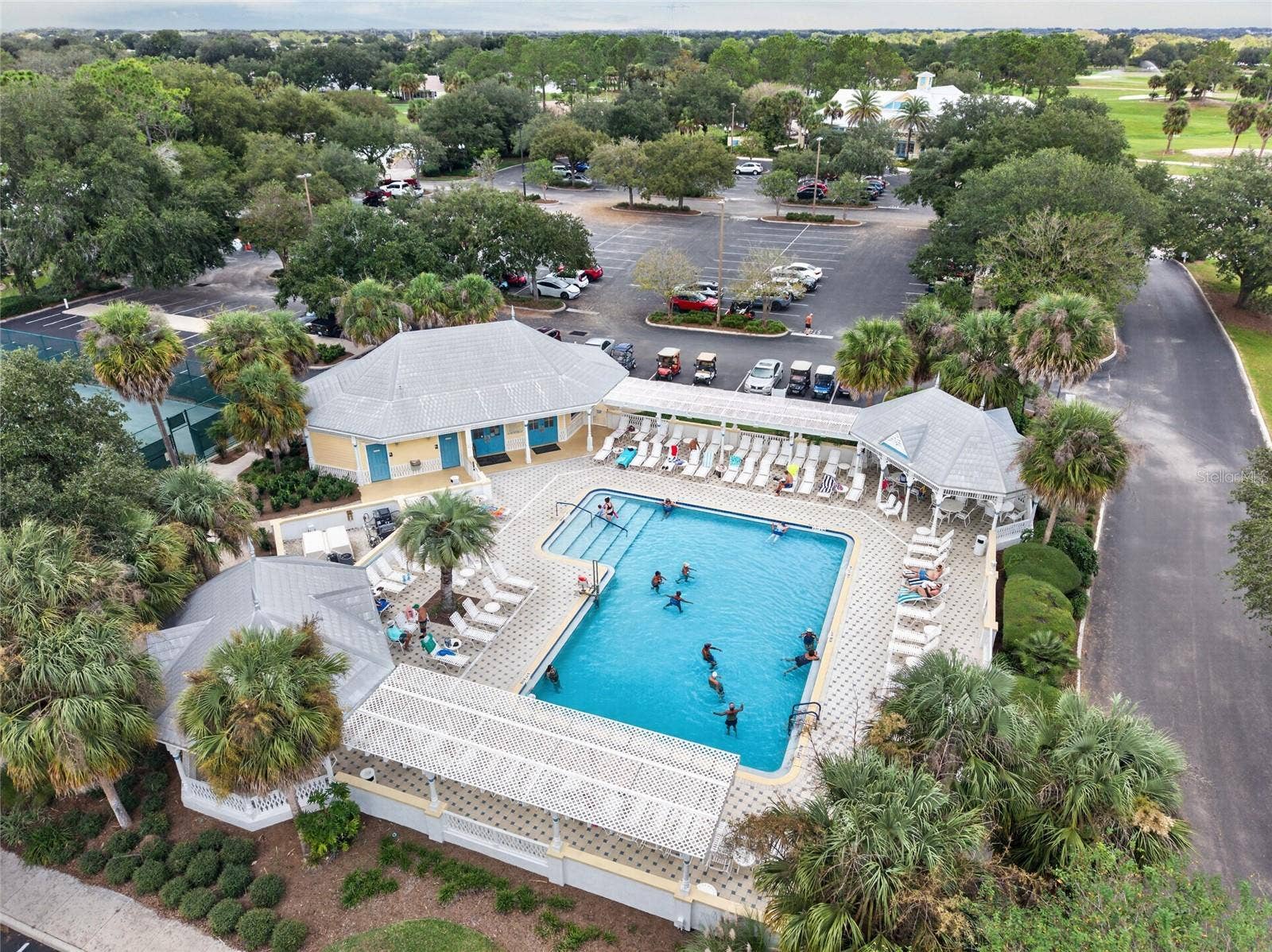 EL SANTIAGO FAMILY POOL - Aerial view of the recreation pool, deck and shaded seating beneath palms.