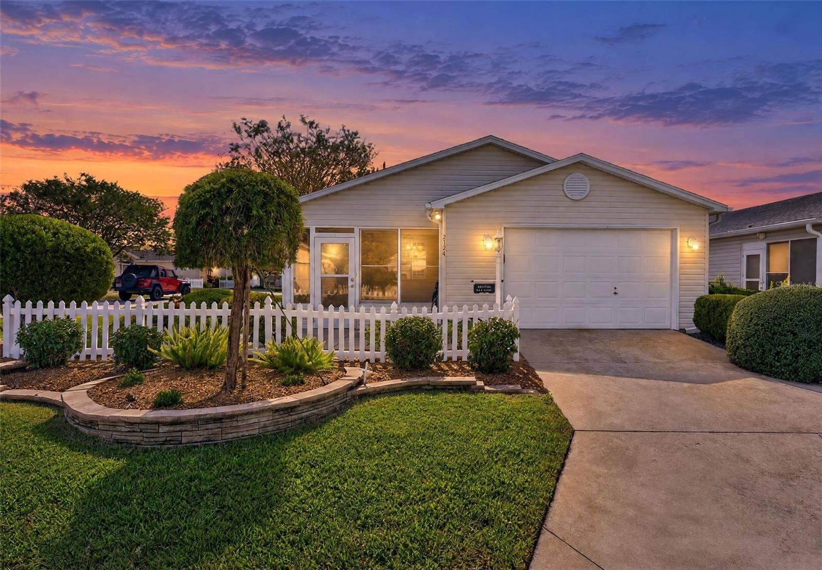 FRONT EXTERIOR - 2124 Escobar Ave in the VILLAGE of SANTO DOMINGO - VILLA VERA CRUZ - This charming 2 BR / 2 BA Cabot Cove Patio Villa sits on a CORNER LOT just minutes from Spanish Springs Town Square!