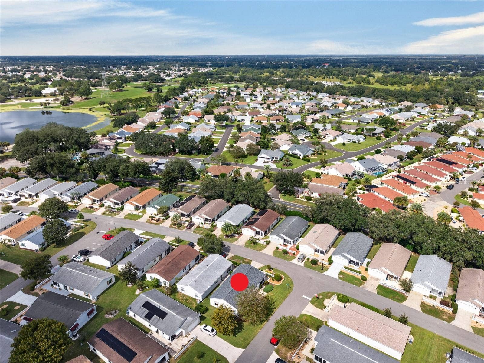 AERIAL  Looking Northwest  Tree-lined streets lead toward the lake and fairways of the El Diablo and El Santiago Executive Golf Courses, with El Santiago Recreation Center's pool and tennis courts close to home.