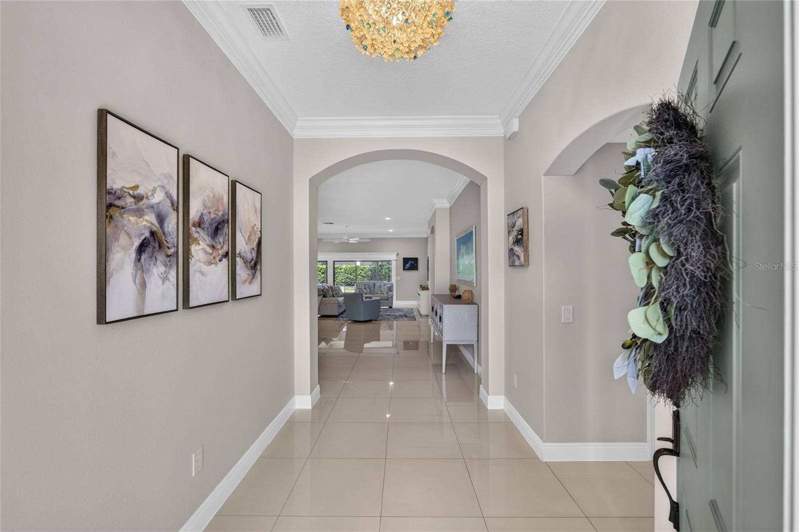 2077 VICKERS PLACE, The Villages, FL 32163 FOYER INTO HOME BEDROOMS 2 AND 3 TO THE RIGHT