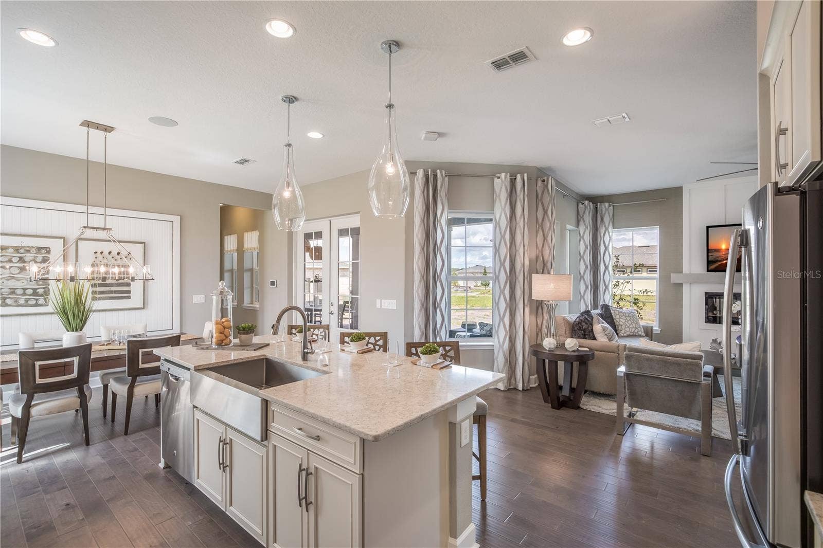 The sample photos included are of the model home and are meant to showcase the craftsmanship and design quality.