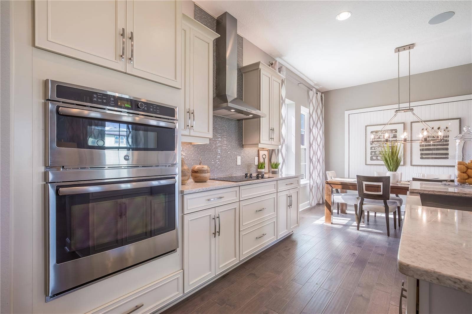 The sample photos included are of the model home and are meant to showcase the craftsmanship and design quality.