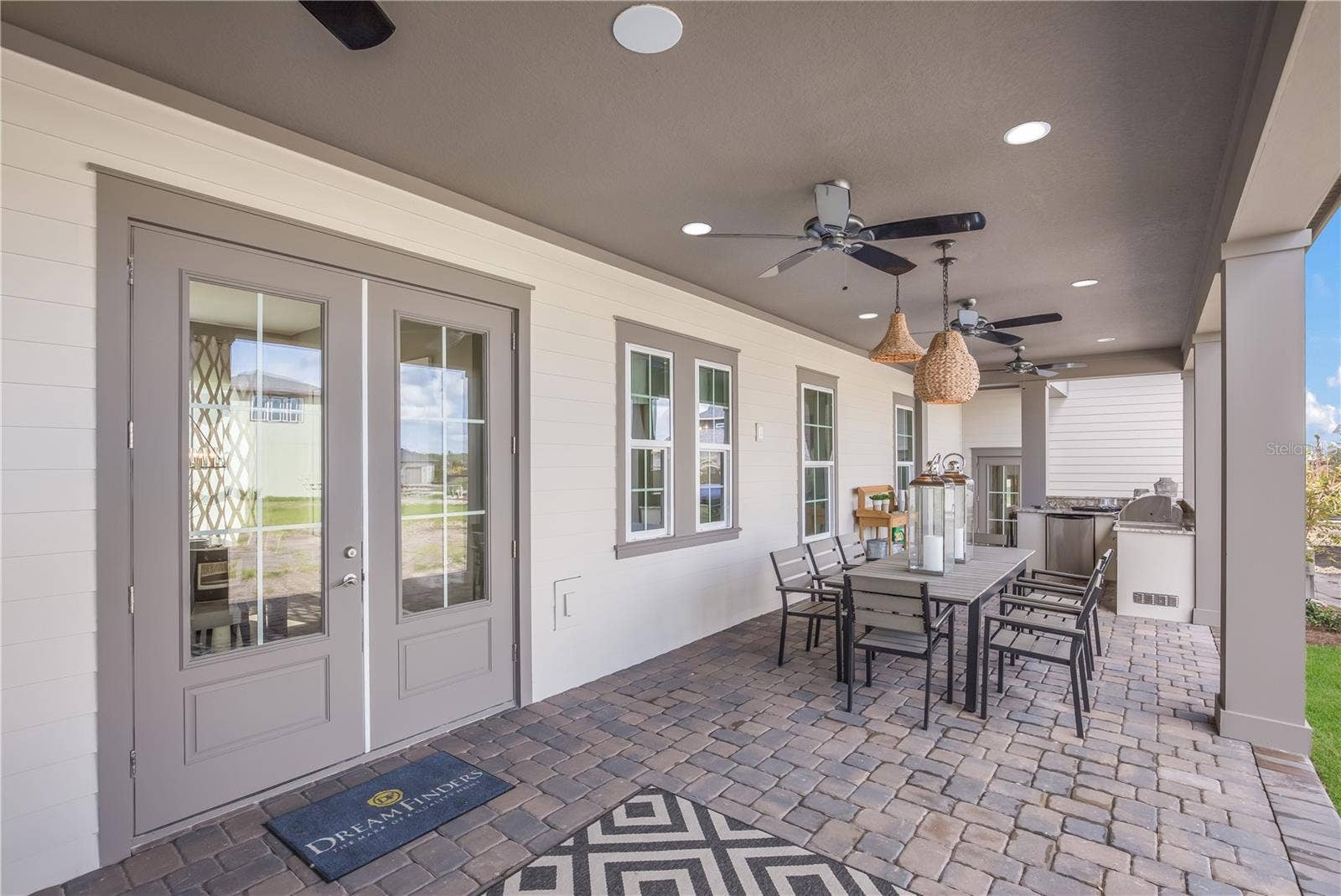 The sample photos included are of the model home and are meant to showcase the craftsmanship and design quality.