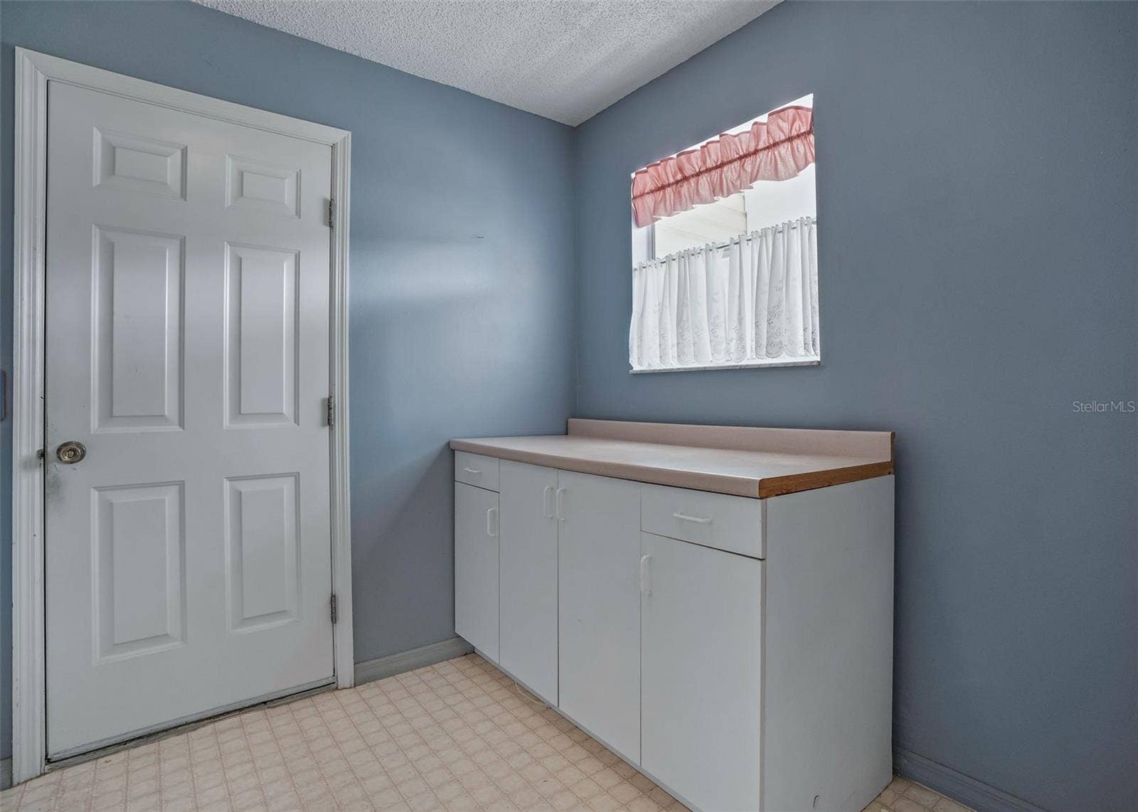 930 RAMOS DRIVE, The Villages, FL 32159 Laundry Room leading to the garage