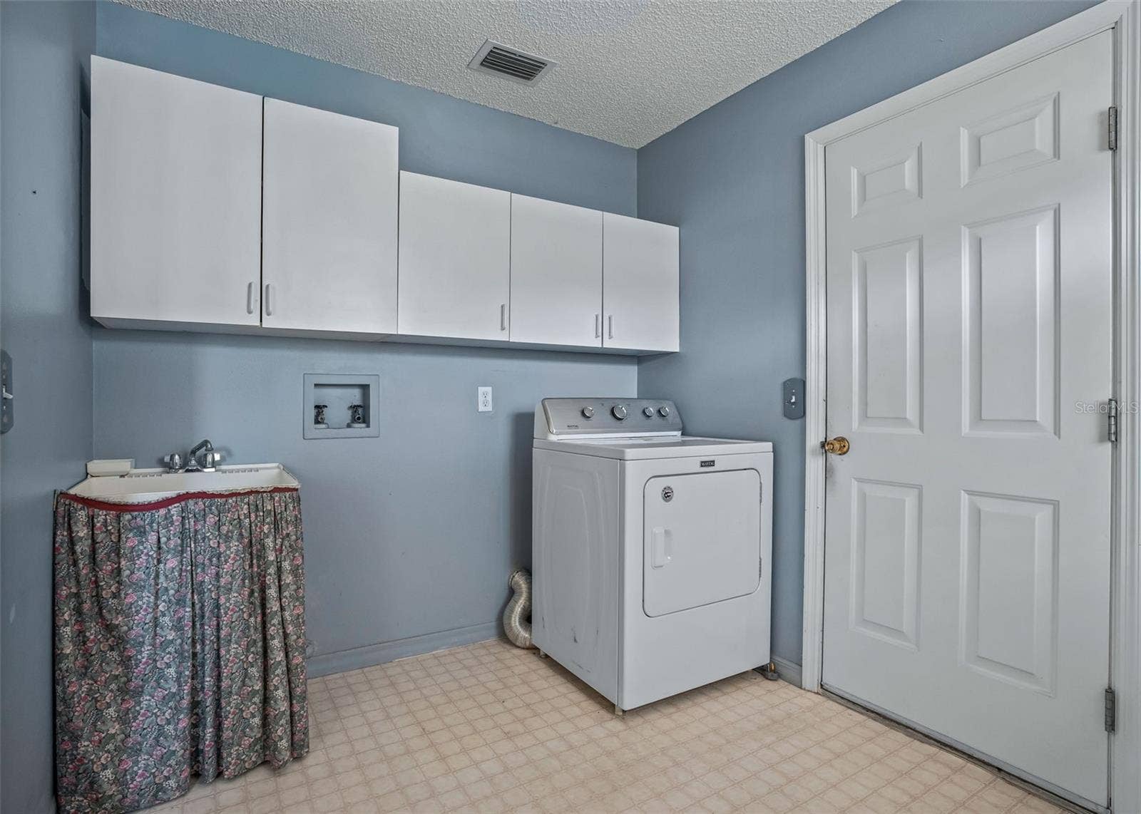 930 RAMOS DRIVE, The Villages, FL 32159 Laundry Room leading to the garage
