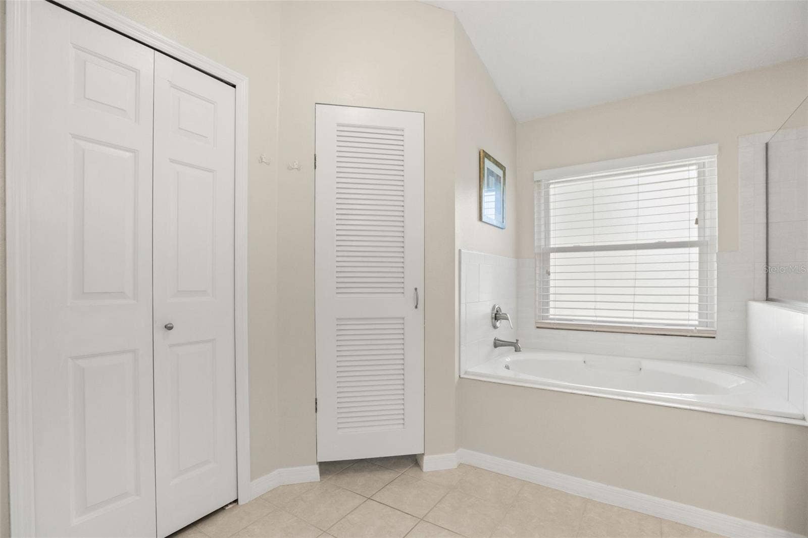 4704 RIVER RIDGE DRIVE, Leesburg, FL 34748 Primary ensuite garden tub with private restroom