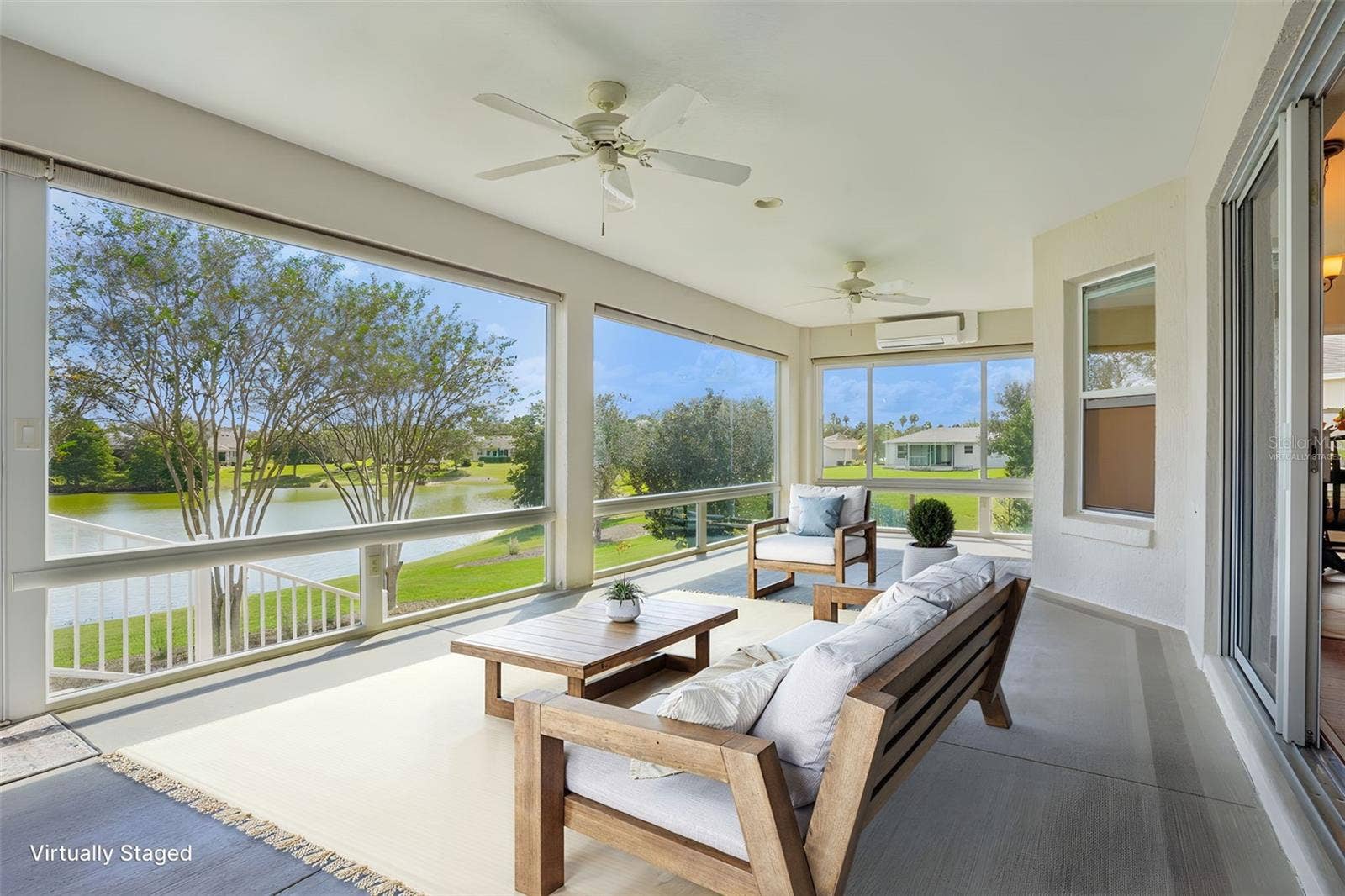 494 ARBELLA LOOP, The Villages, FL 32162 Virtually Staged Enclosed Lanai with Panoramic Water View