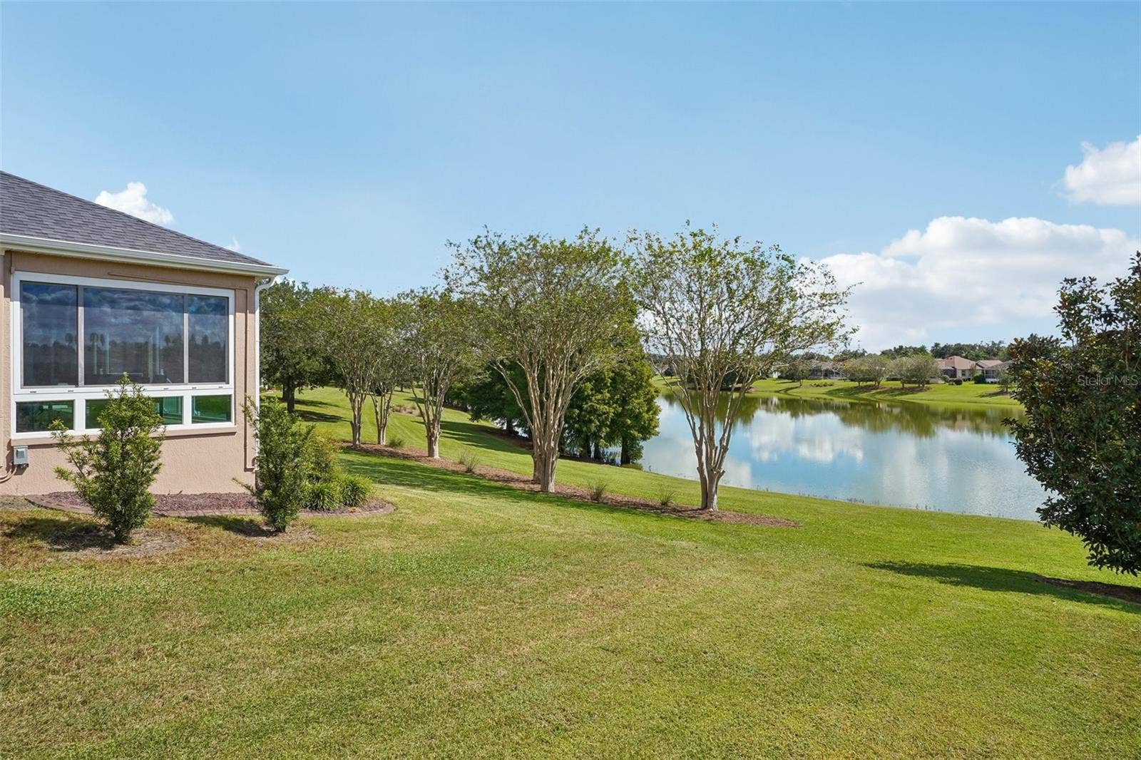 494 ARBELLA LOOP, The Villages, FL 32162 Backyard with Water View