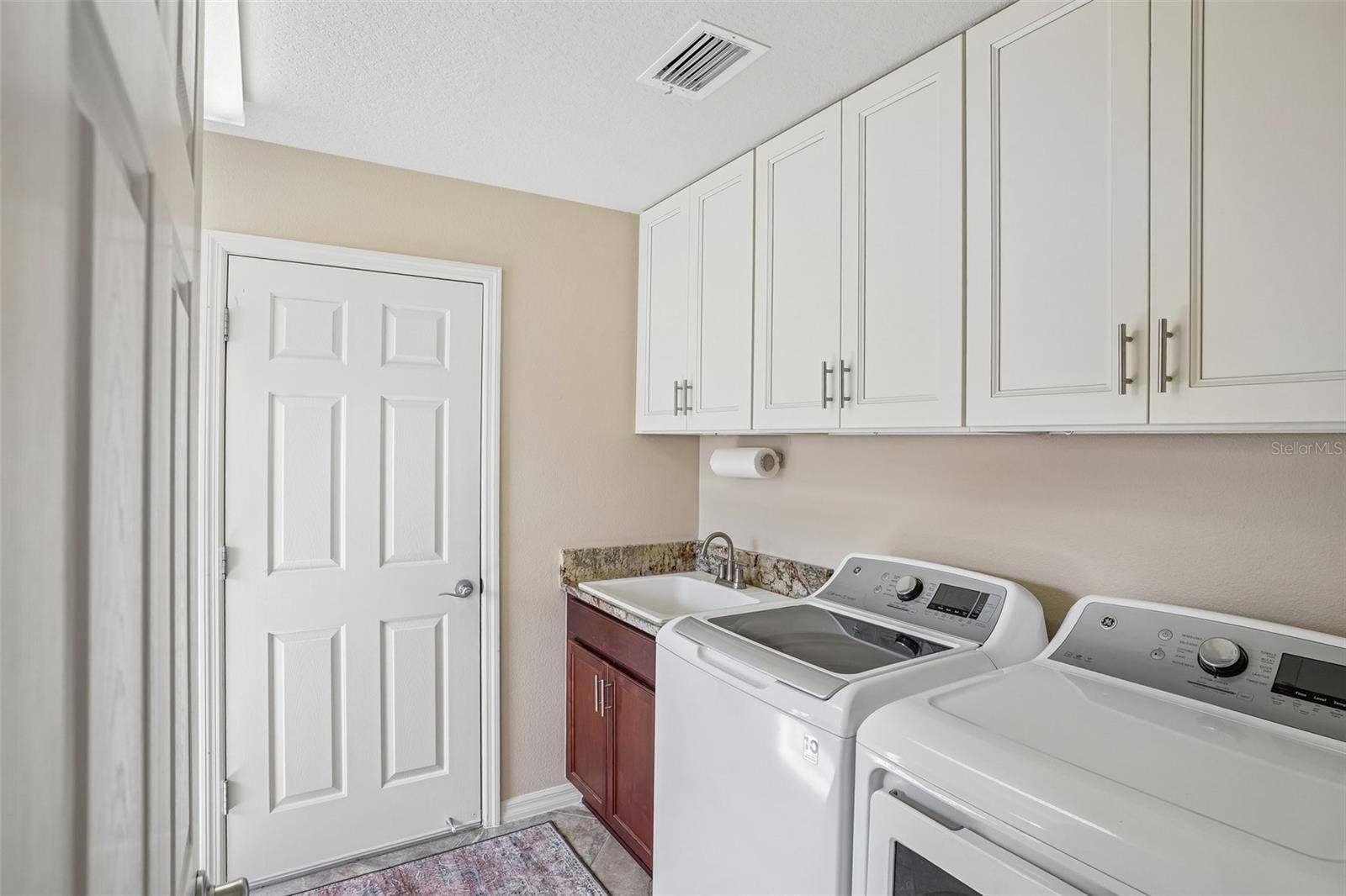 494 ARBELLA LOOP, The Villages, FL 32162 Laundry Room with Sink and New Soft Close Cabinets