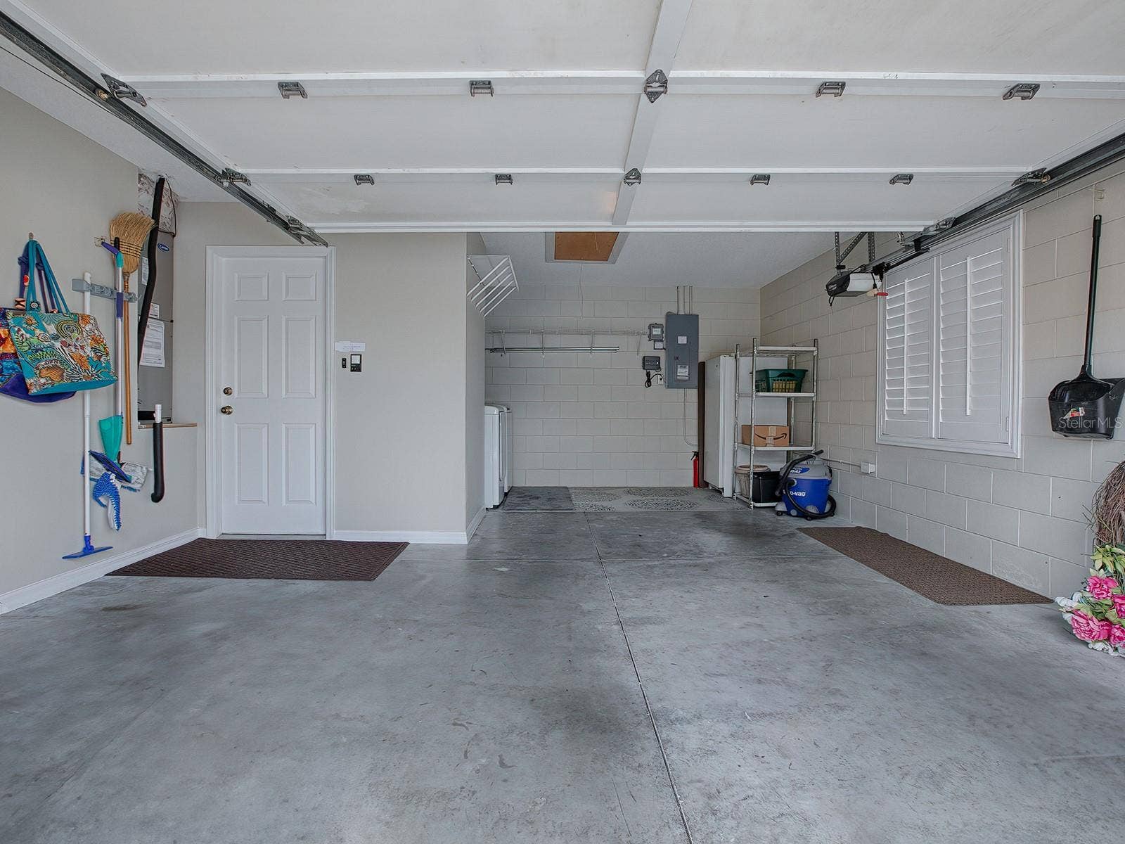 1129 SANTA CRUZ DRIVE, The Villages, FL 32162 Garage with enough room for one car and a golf cart