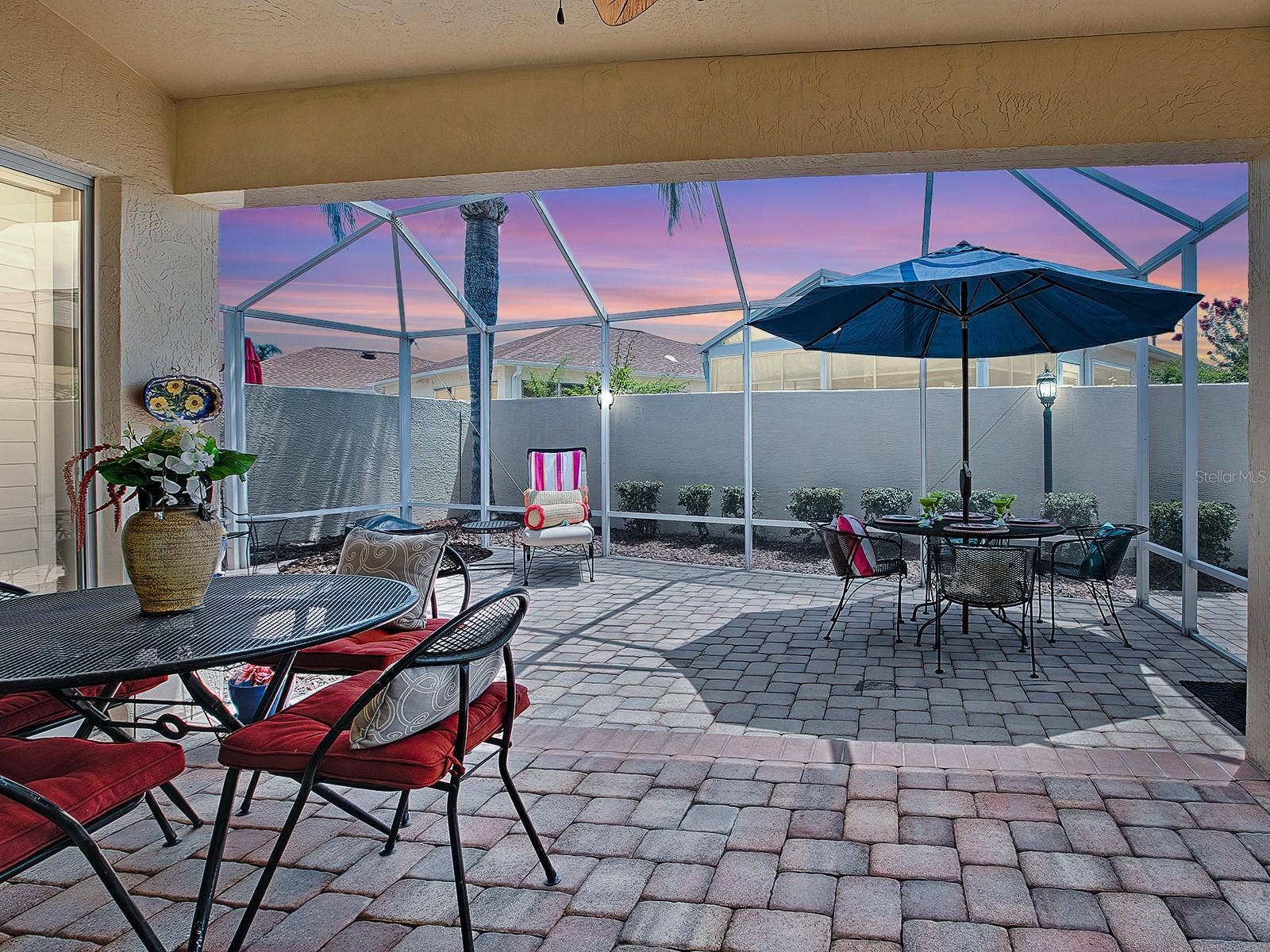 1129 SANTA CRUZ DRIVE, The Villages, FL 32162 Covered lanai and huge birdcage area (furniture shown for staging purposes only)