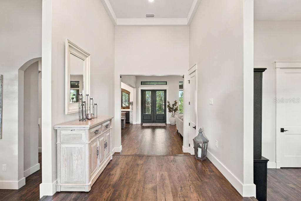 Light filled foyer leads to den/office and great room