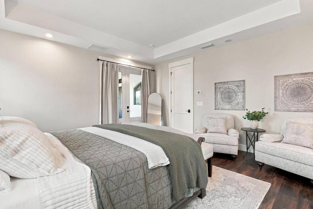 Enjoy Tray Ceilings with additional sitting area, and sconce lighting