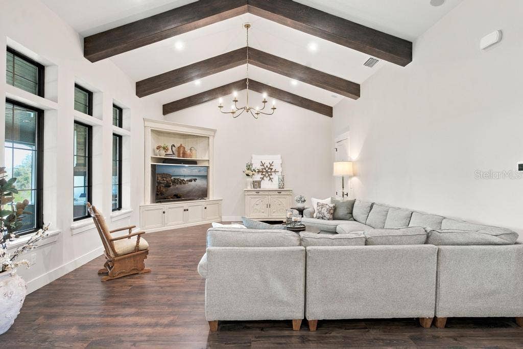 Great room with wood beamed ceilings