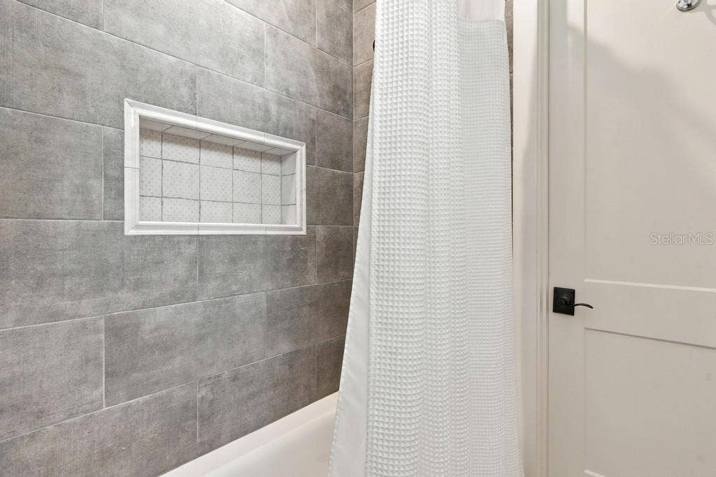 Custom tub/shower in "en-suite" two, leads to walk-in closet