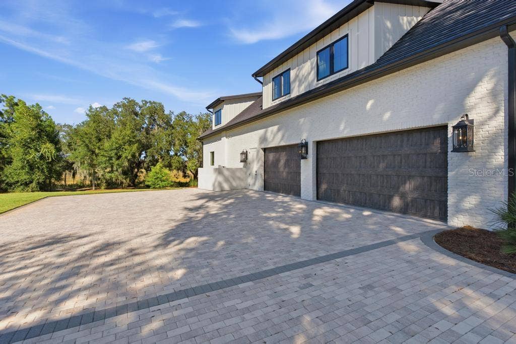 Room for all your cars and toys  with extra brick paver driveway