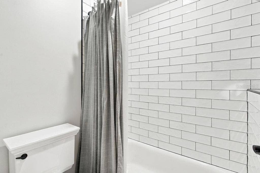 Tub and shower combo with tile accent wall