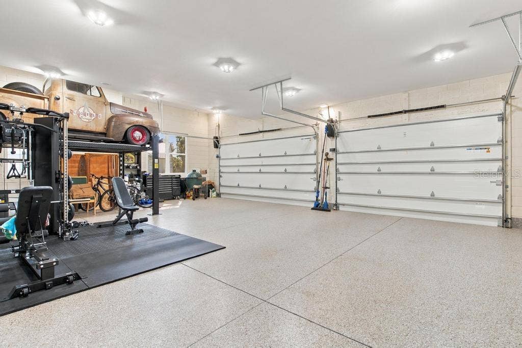 Huge 3 Car Garage Nearly 1100 Sqft... enjoy epoxy floors and bright LED lighting!