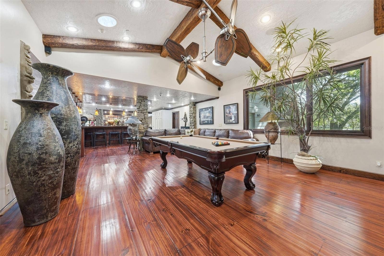 15211 VINOLA PLACE, Montverde, FL 34756 entertainment - pool and TV off the bar area
