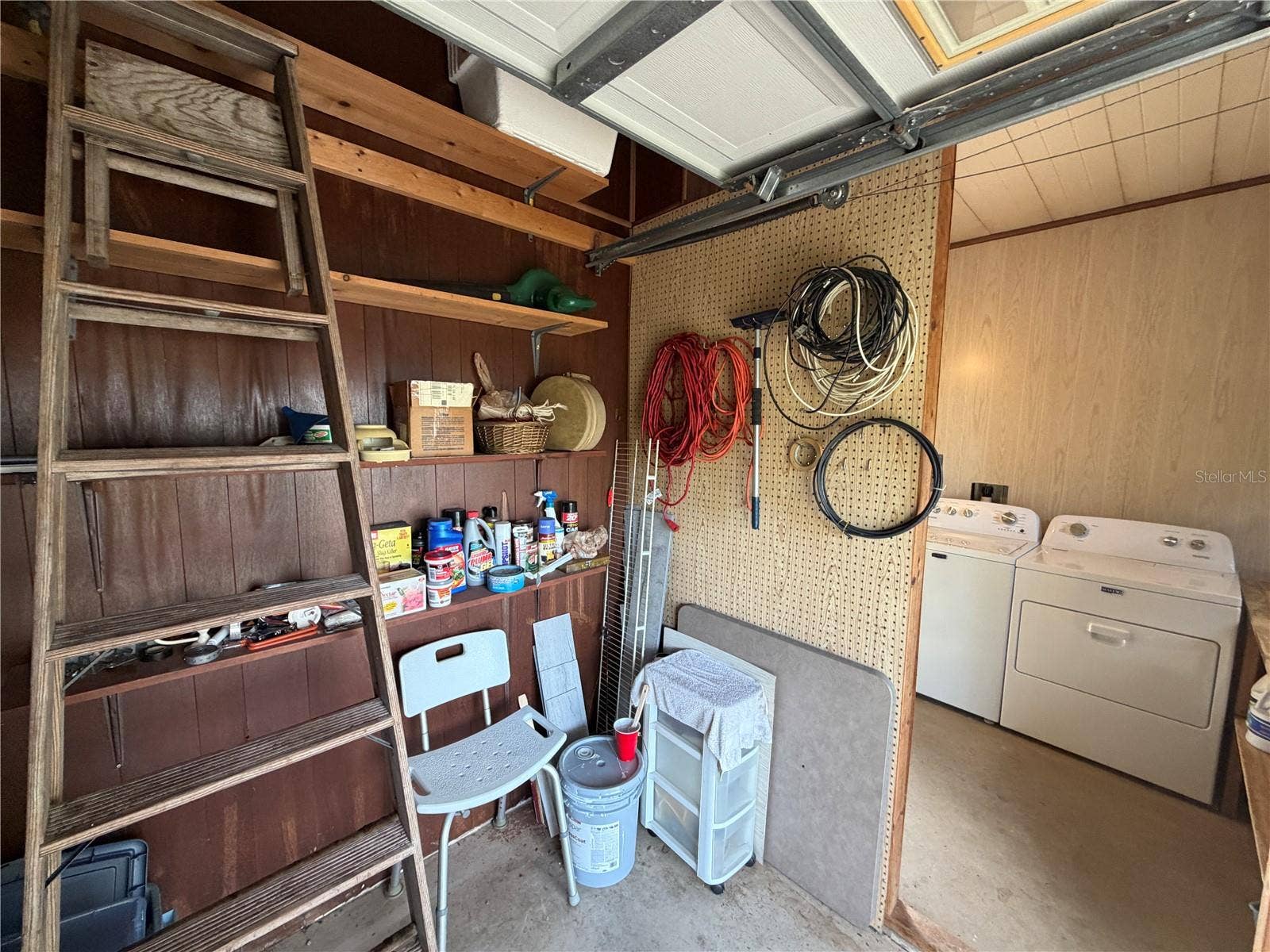 38 N BOBWHITE ROAD, Wildwood, FL 34785 Golf Cart Garage View to Laundry AreaPegboard Walls