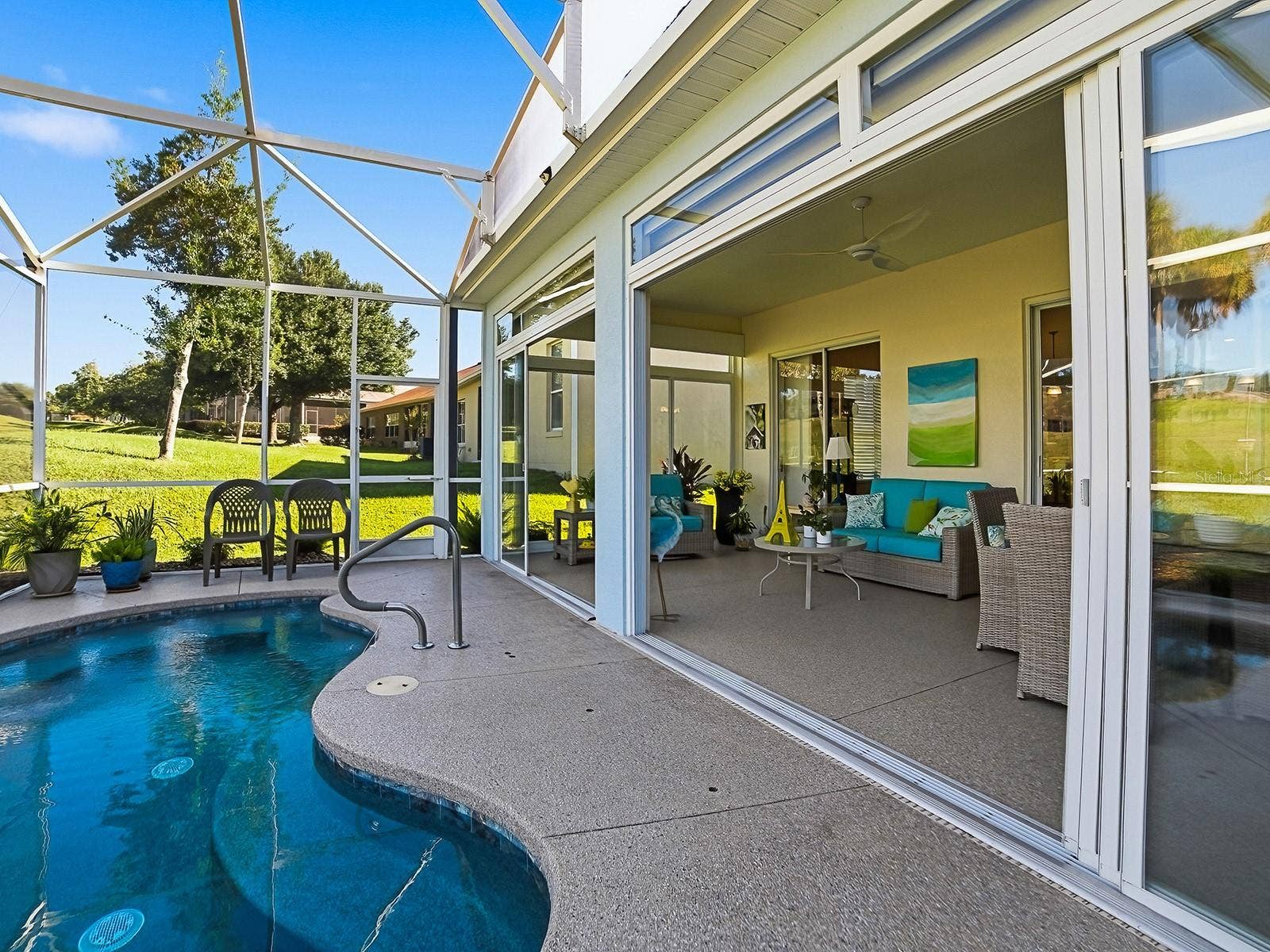 4818 SABLE RIDGE COURT, Leesburg, FL 34748 Open up the lanai to your private spool.