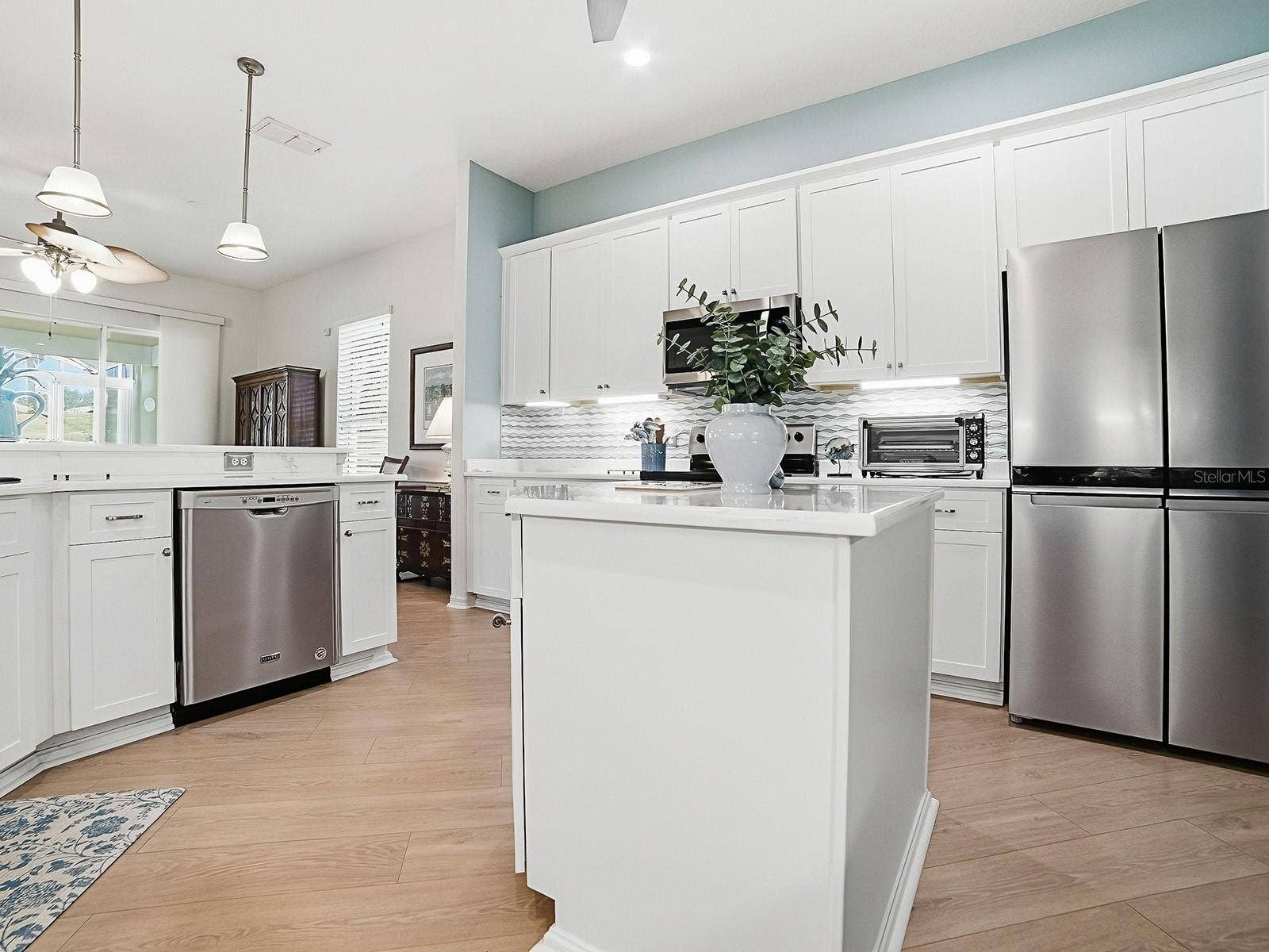4818 SABLE RIDGE COURT, Leesburg, FL 34748 Lots of light and cabinets in this beautiful kitchen