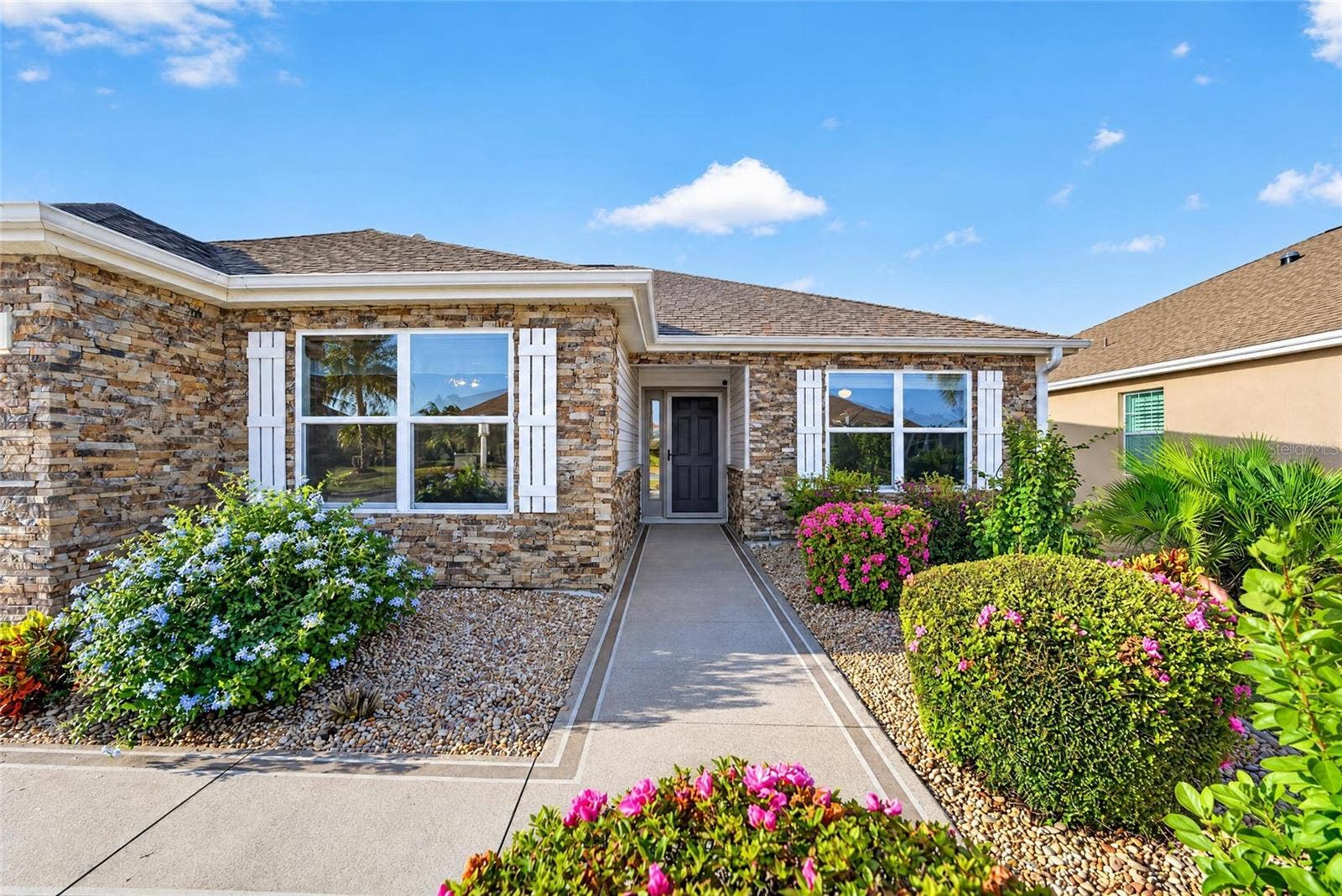3552 WYNGATE PLACE, The Villages, FL 32163 Beautiful custom stone & shutters on home