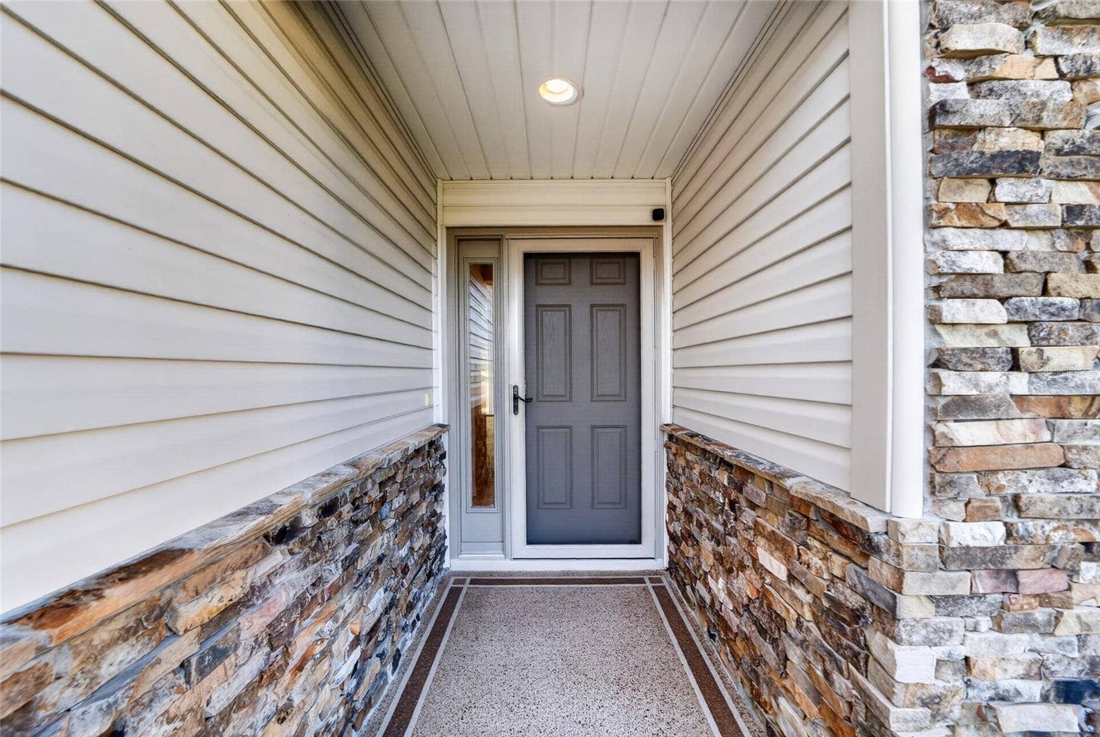 3552 WYNGATE PLACE, The Villages, FL 32163 Covered front porch with screen door