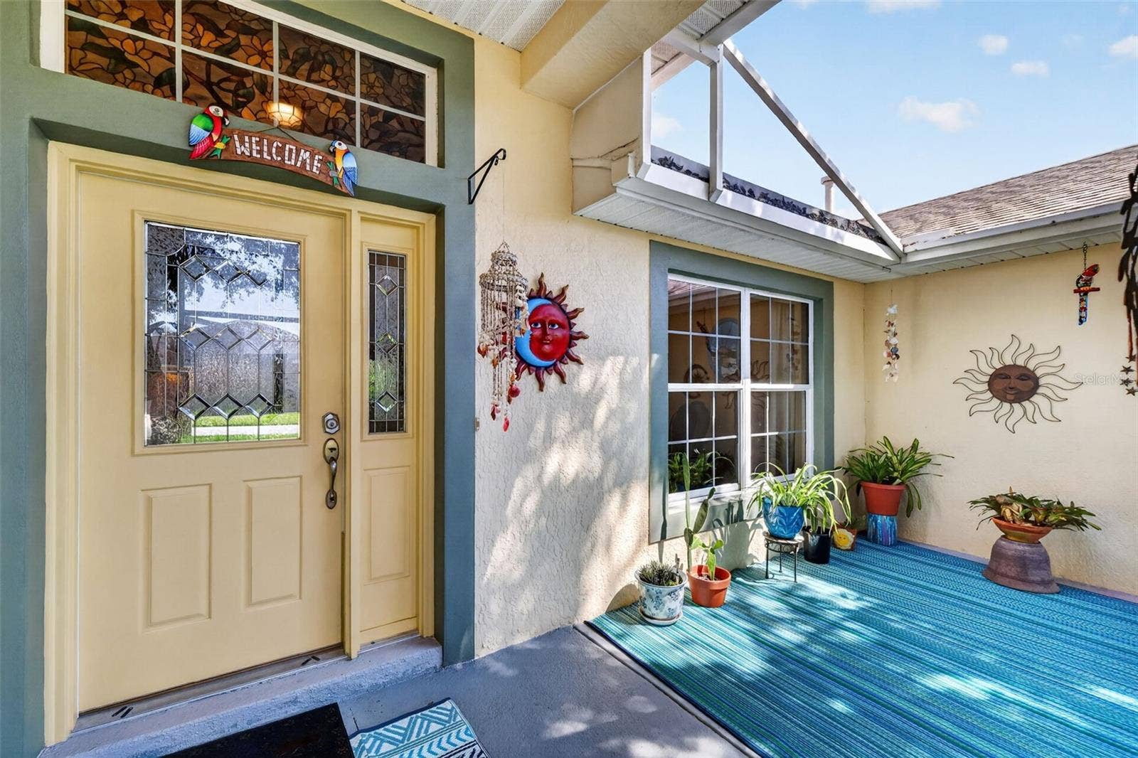 6121 HUNTERS RIDGE AVENUE, Leesburg, FL 34748 Charming Front Entry with Extended Birdcage