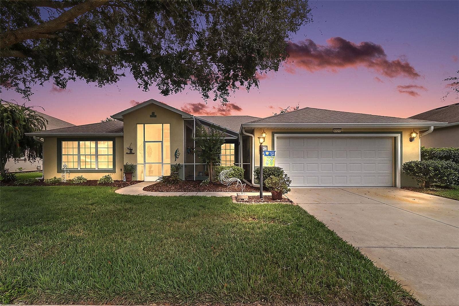 6121 HUNTERS RIDGE AVENUE, Leesburg, FL 34748 Twilight Front Elevation